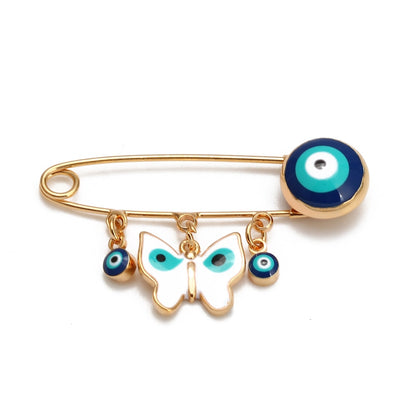 Ward off Bad Luck with our Turkish Evil Eye Brooch Pin with Flower Crown, Hamsa Hand, and Star Charms